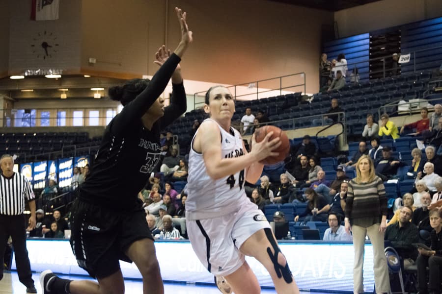 Senior forward Alyson Doherty goes for a layup against the Rainbow Wahine. (BRIAN LANDRY / AGGIE)