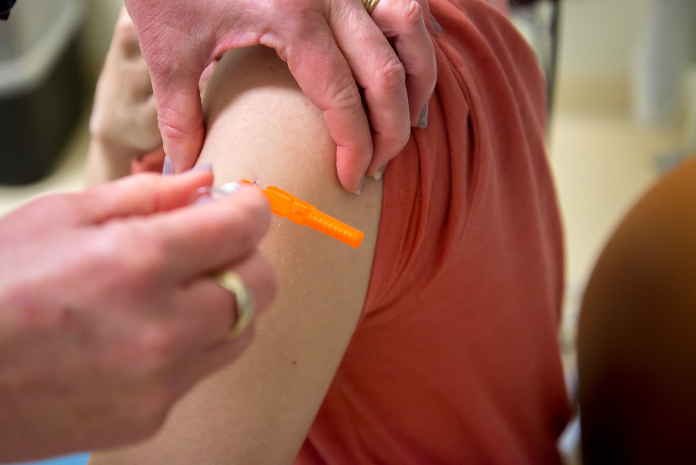 Woman receives vaccine at UC Davis clinic