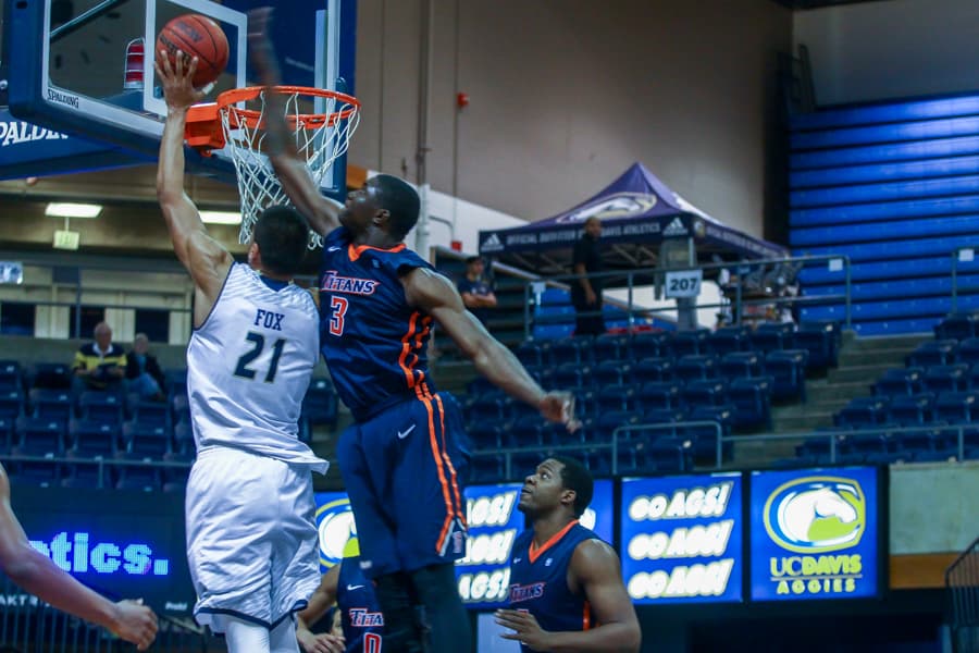 The Aggies' leading scorer senior forward Josh Fox drives past Cal State Fullerton junior forward Tim Myles. (HANNAH WODRICH / AGGIE)