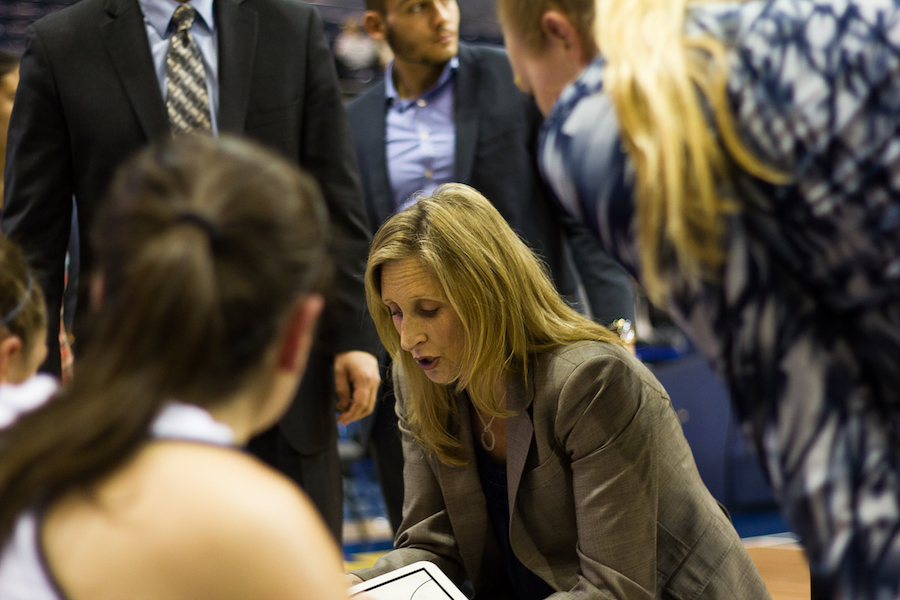 (-Head Coach Jennifer Gross runs through defensive strategies during a break in the action.) AARON BURBANK / AGGIE