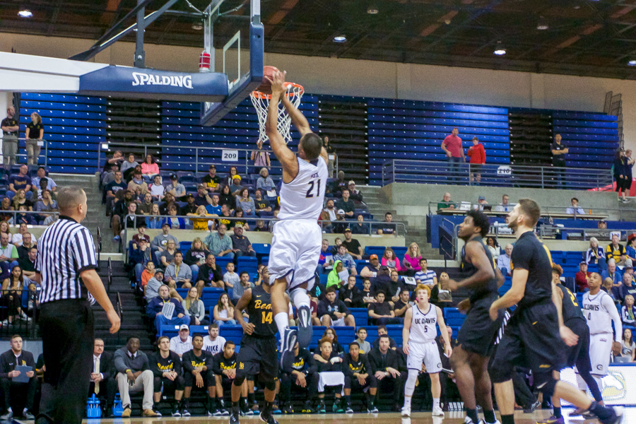 Senior forward Josh Fox slams down a two on his road to a 20-point game. (HANNAH WODRICH / AGGIE)