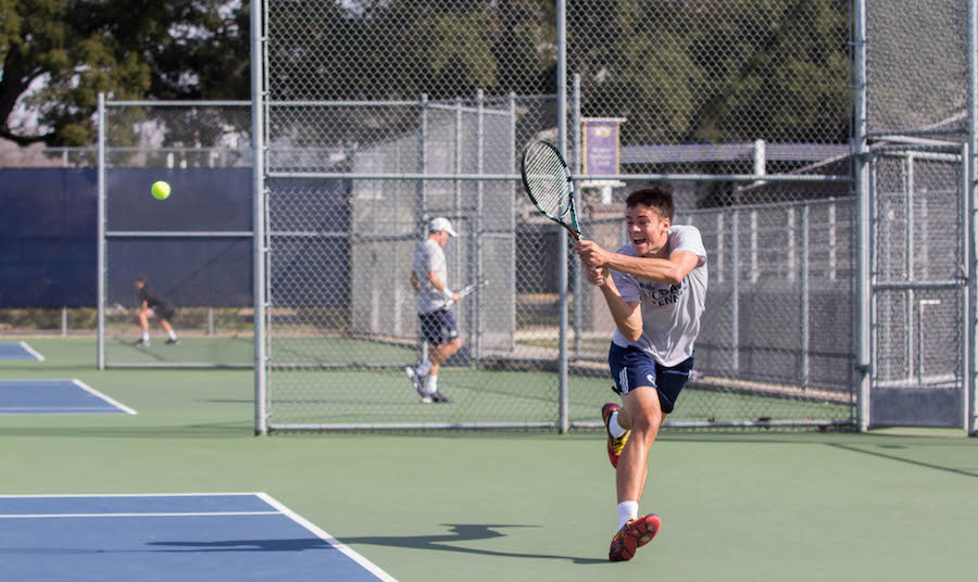 After a tough start to the season, junior Alec Adamson fights hard in his victory against the USF Dons. (DANIEL TAK / AGGIE)