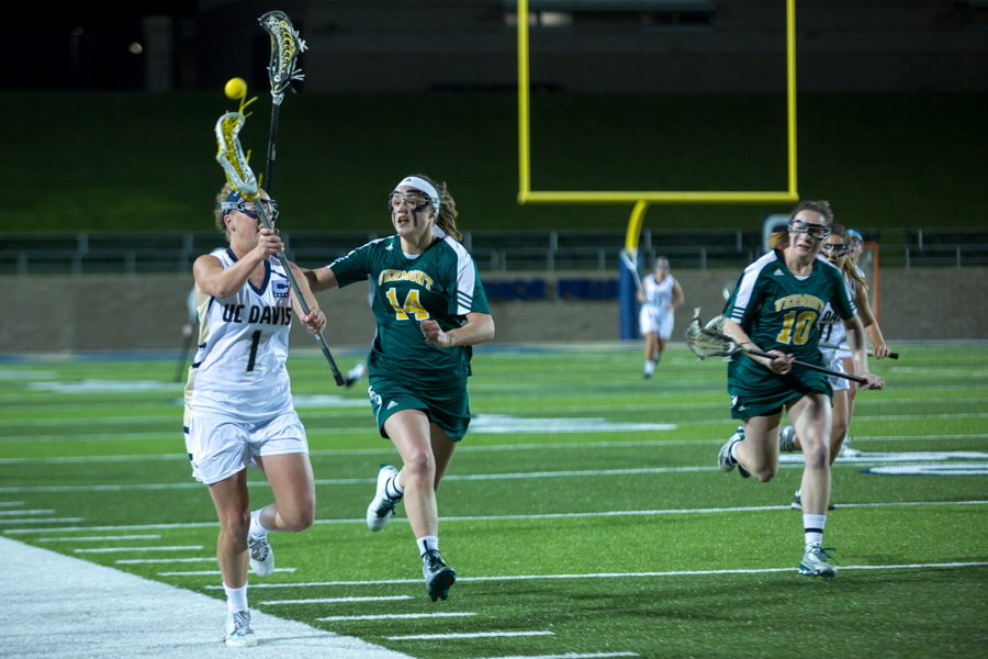 With no one able to catch her, senior midfielder Courtney Neff drives down the line before passing the ball to set up an Aggie scoring opportunity. (JAY GELVEZON / AGGIE)