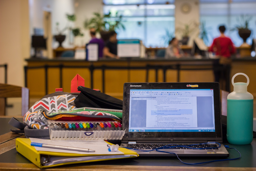 Studying in front of the circulation desk on the first floor of Shields is great if you like the hustle and bustle of a library. (AMY HOANG)