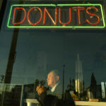 Ted Ngoy stands inside a Christy’s Donut Shop: this one is located in Hawthorne. Ted built this donu