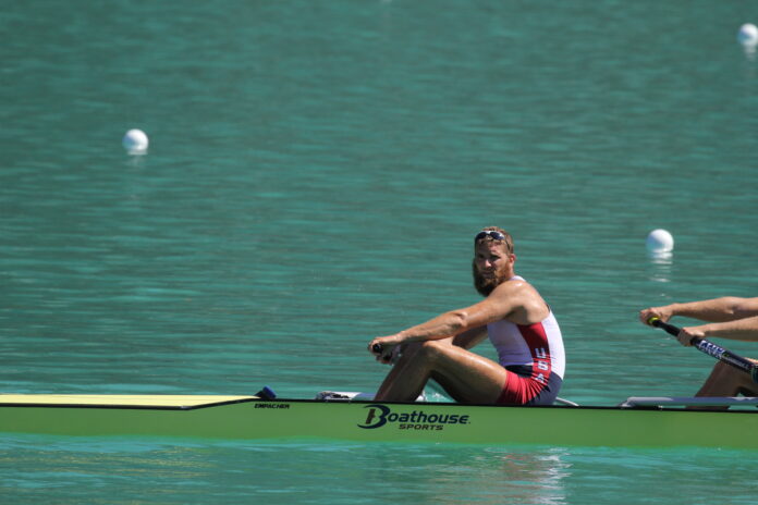 Photo of Seth Weil on a row boat in the water