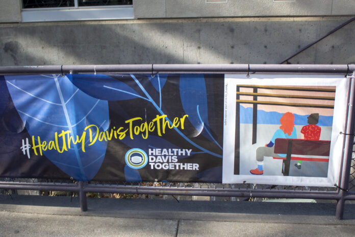 A picture of a bench advertising the Healthy Davis initiative